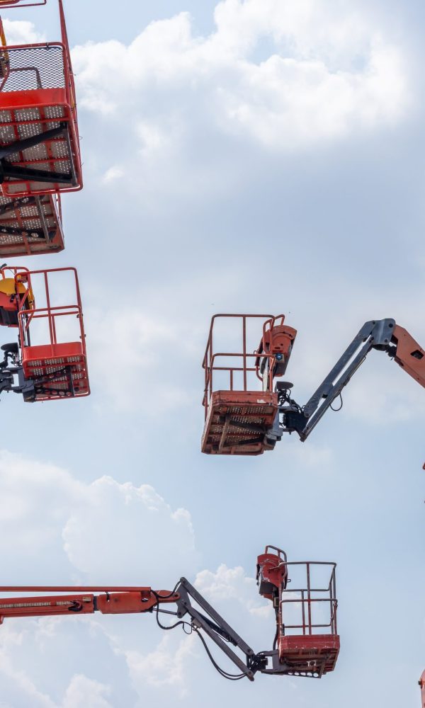 Articulate boom lift with blue sky background, Aerial platform lift telescopic boom lift hydraulic boom lift, Mobile construction crane, Construction boom lifts